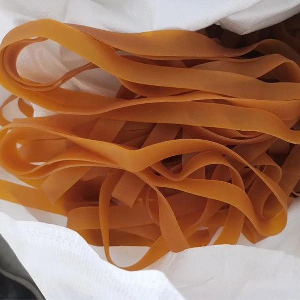 Wide rubber bands for shipping container lashing
